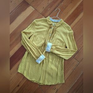 Yellow Maeve blouse with polka dot details, from Anthropologie